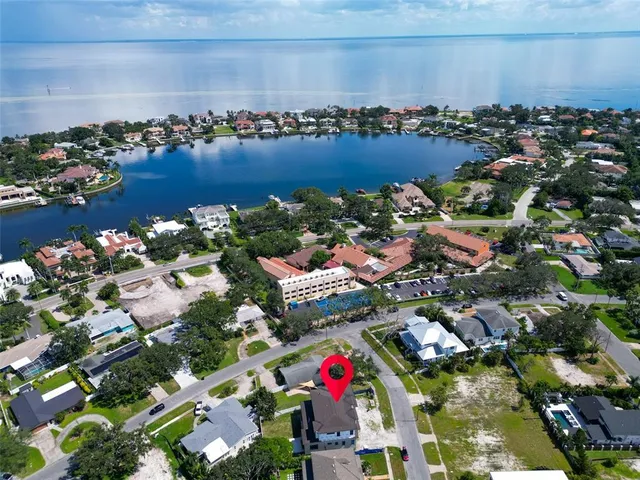an aerial view of residential building and lake