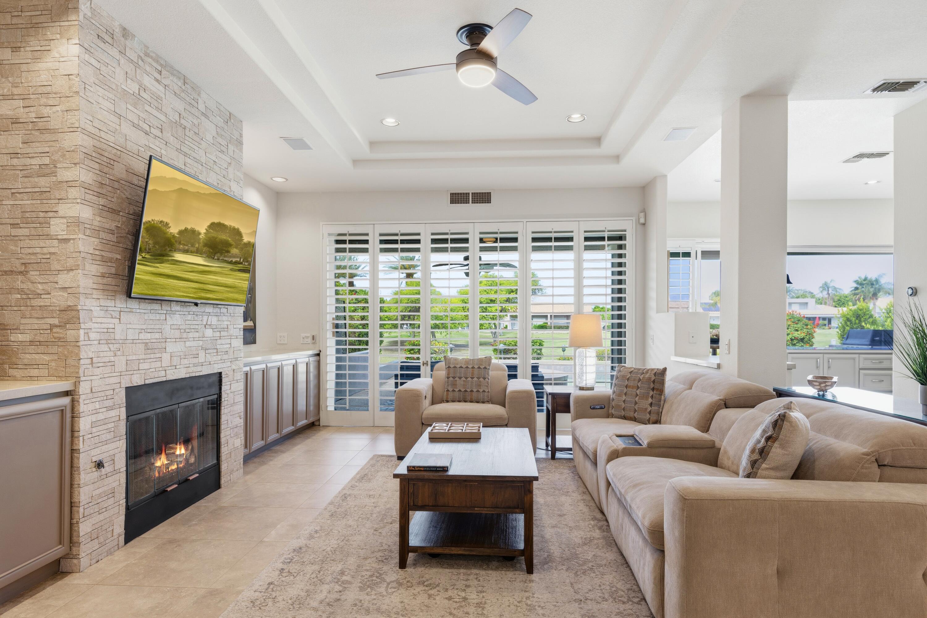 39 Augusta Drive Rancho Mirage, CA 92270 - Photo 10 of 53 a living room with furniture and a fireplace