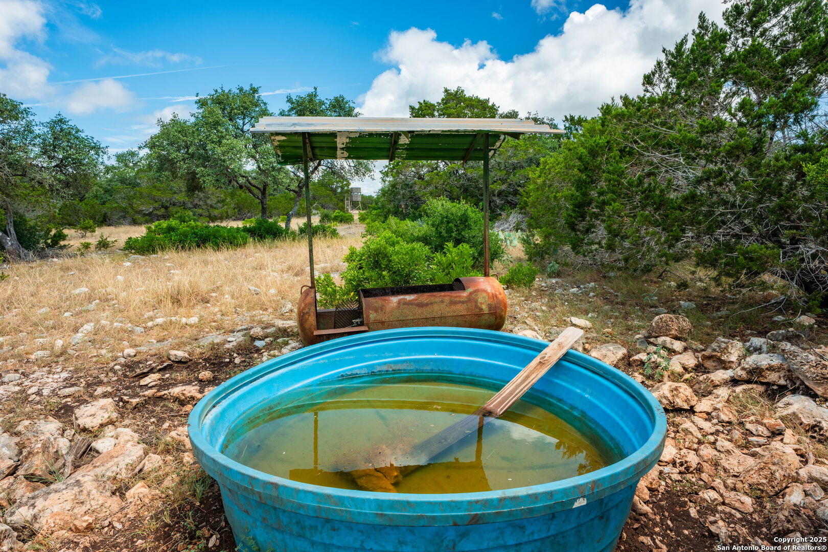 485 Mitchell Ranch Road Camp Wood, TX 78833 - Photo 16 of 47 a view of a swimming pool with an outdoor seating