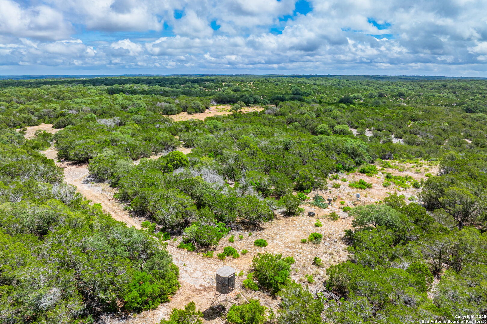 485 Mitchell Ranch Road Camp Wood, TX 78833 - Photo 3 of 47 a view of a lush green field