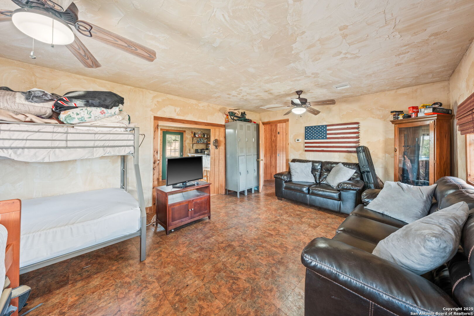 485 Mitchell Ranch Road Camp Wood, TX 78833 - Photo 31 of 47 a living room with furniture and a fireplace