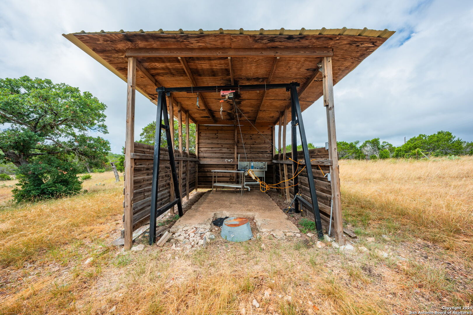485 Mitchell Ranch Road Camp Wood, TX 78833 - Photo 41 of 47 a view of a wooden house with a snow on the road