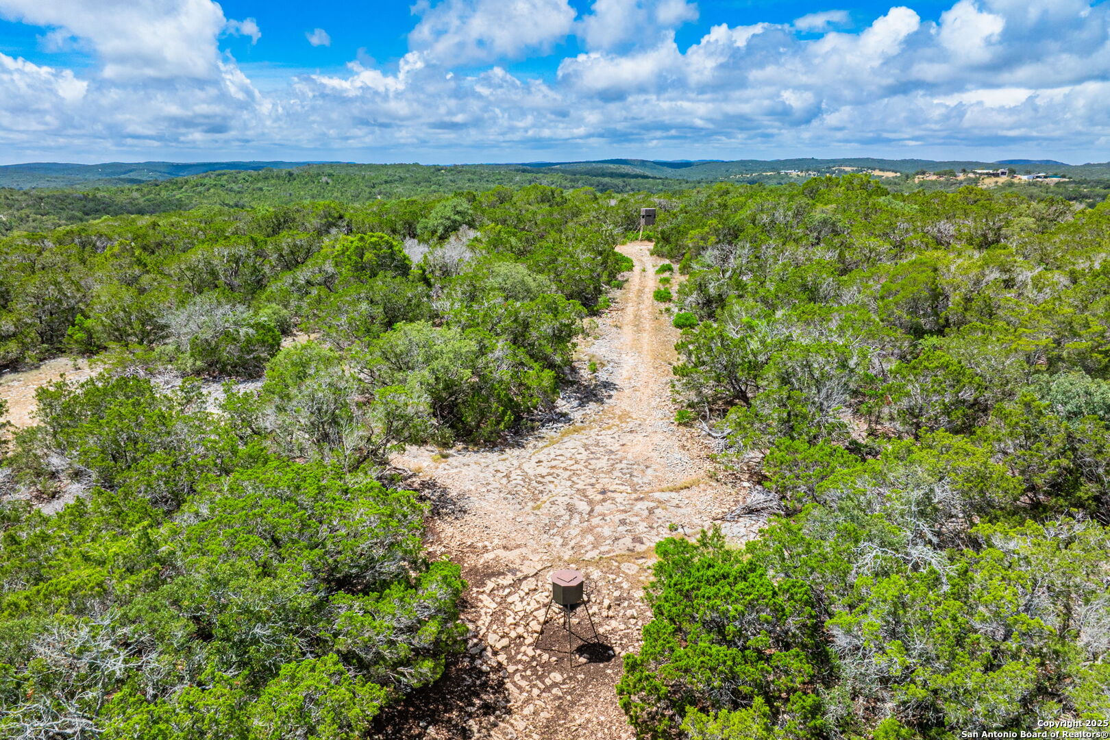 485 Mitchell Ranch Road Camp Wood, TX 78833 - Photo 5 of 47 a view of a lake with a yard