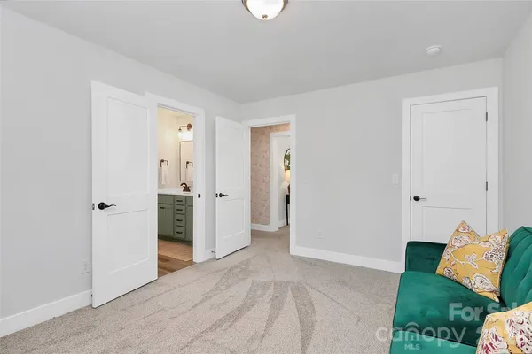 a white toilet sitting next to a shower curtain