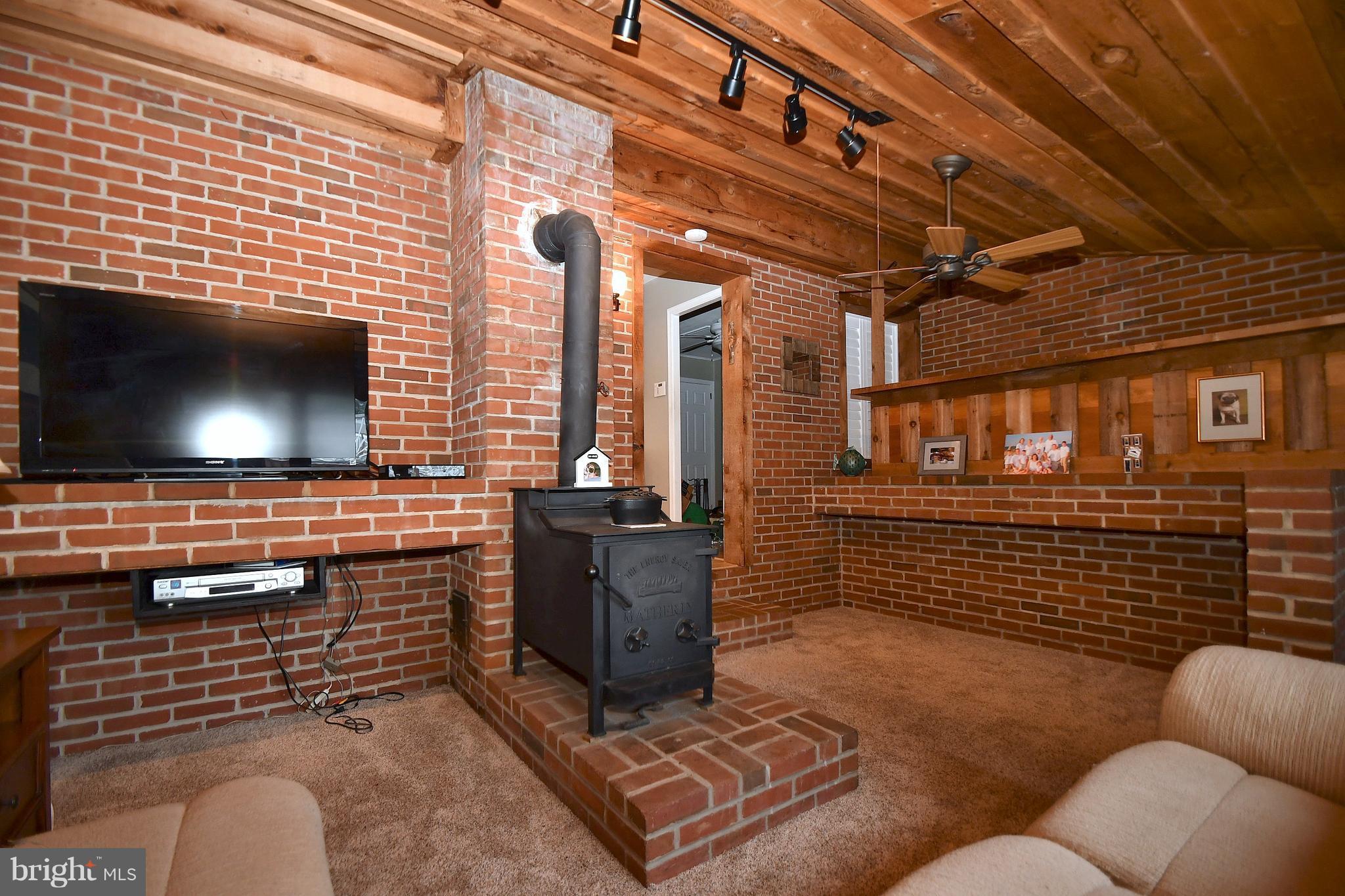 112 Church Road Owings Mills, MD 21117 - Photo 17 of 30 Brick Sunroom w/Woodstove