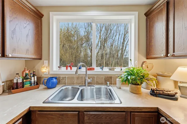 a kitchen with a sink and a window