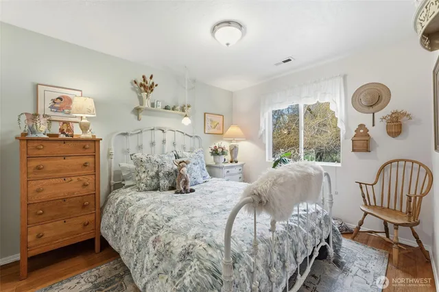 a bedroom with a bed and chair