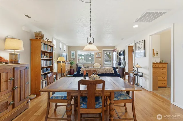a view of a dining room with furniture window and wooden floor