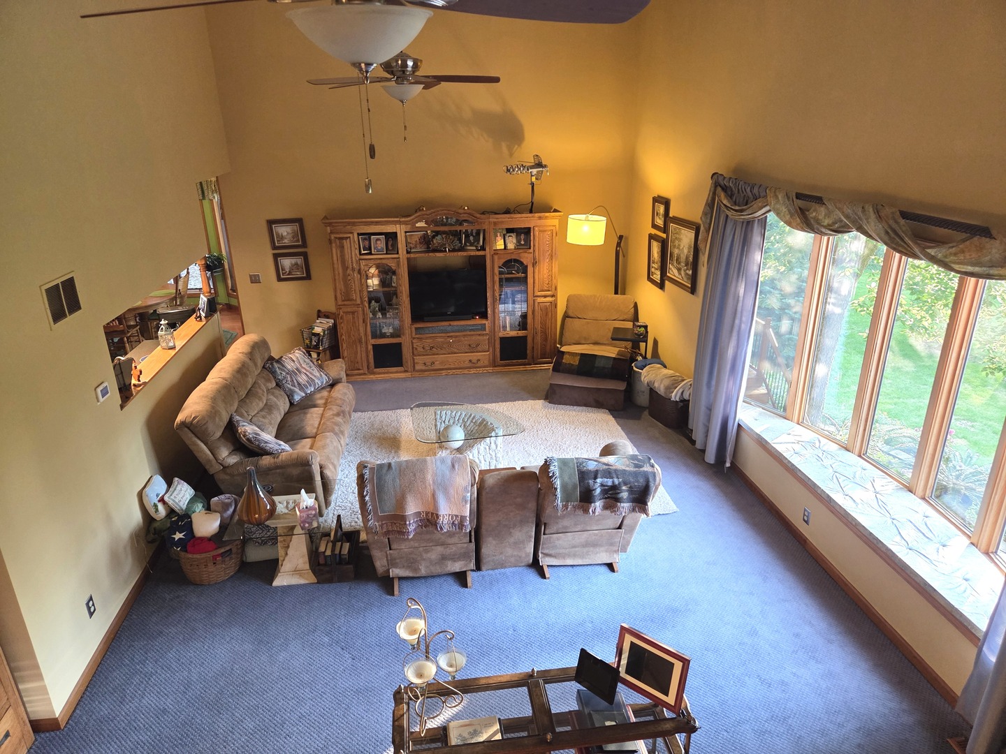 37322 Indian Spring Road Saybrook, IL 61770 - Photo 18 of 77 a living room with furniture and a floor to ceiling window