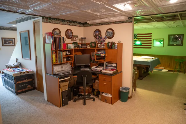 a view of a chairs and table in backyard