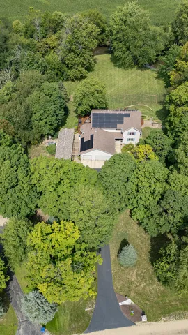 a kitchen with granite countertop wooden cabinets a sink and dishwasher