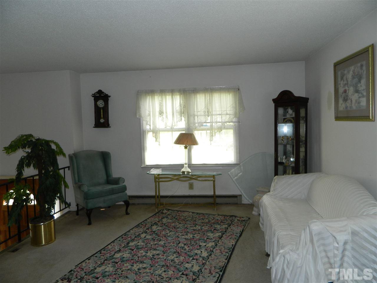 1104 Mockingbird Drive Raleigh, NC 27615 - Photo 5 of 10 a living room with furniture and a window