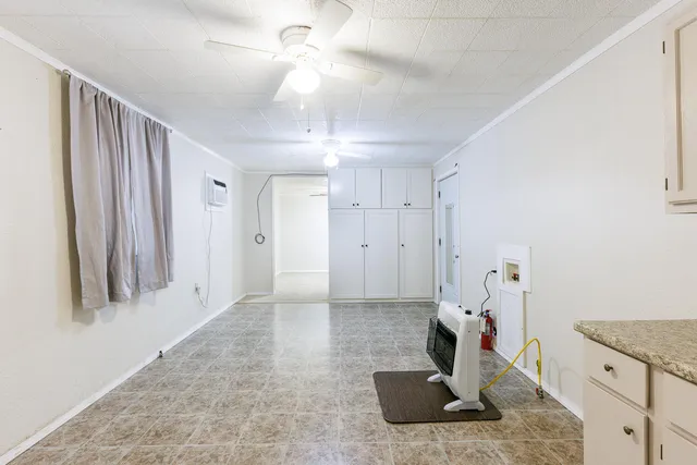 a kitchen with white cabinets