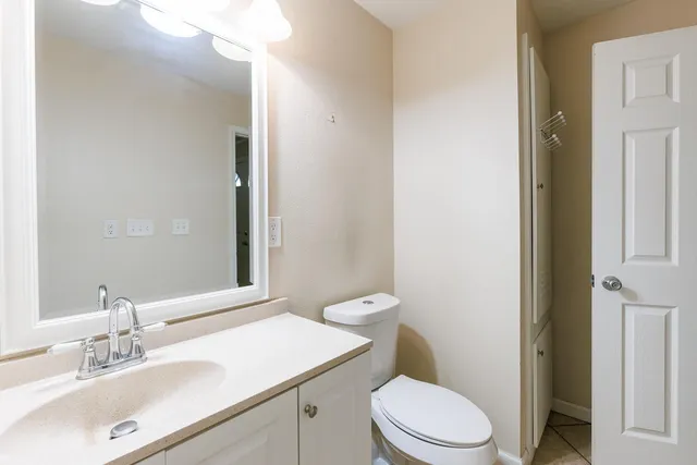 a bathroom with a sink vanity and a mirror