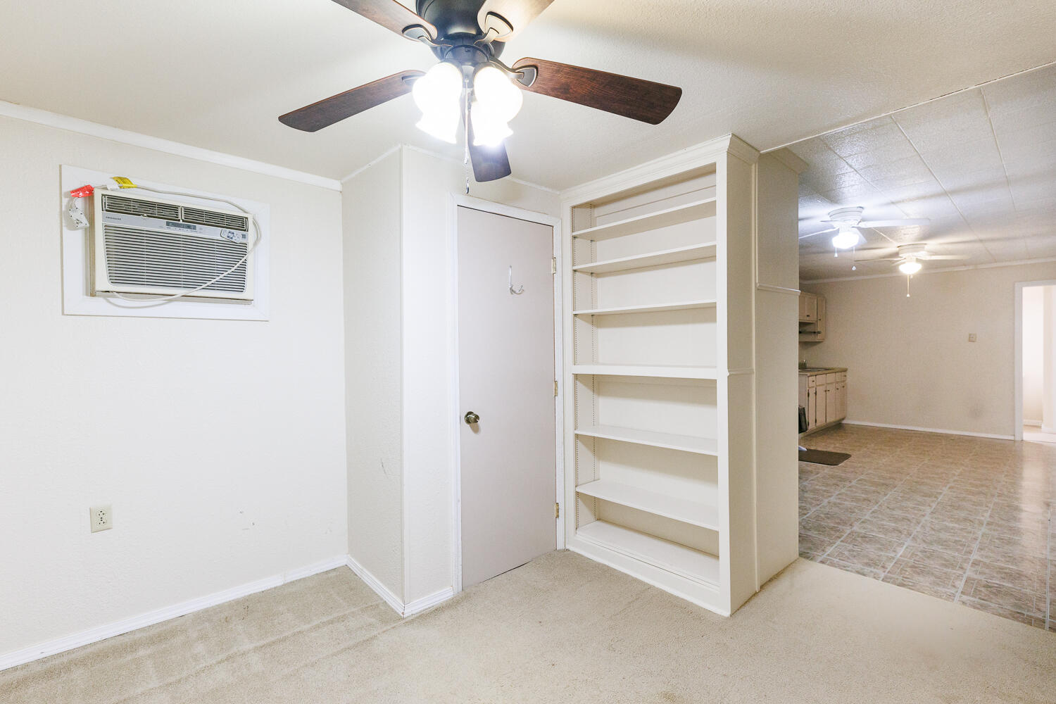 211 Chestnut Street Idalou, TX 79329 - Photo 27 of 31 a view of a room with a ceiling fan