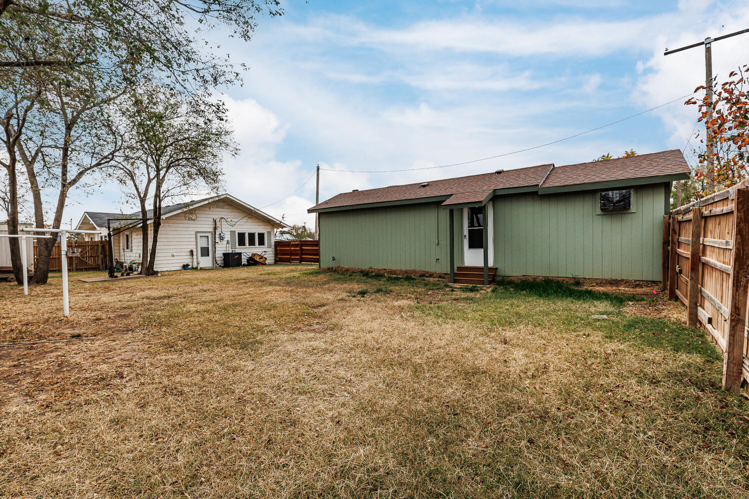 211 Chestnut Street Idalou, TX 79329 - Photo 31 of 31 a house view with wooden fence