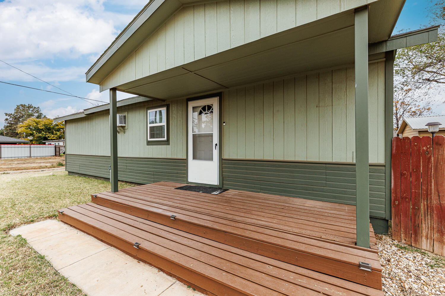 211 Chestnut Street Idalou, TX 79329 - Photo 8 of 31 a house with trees in front of it
