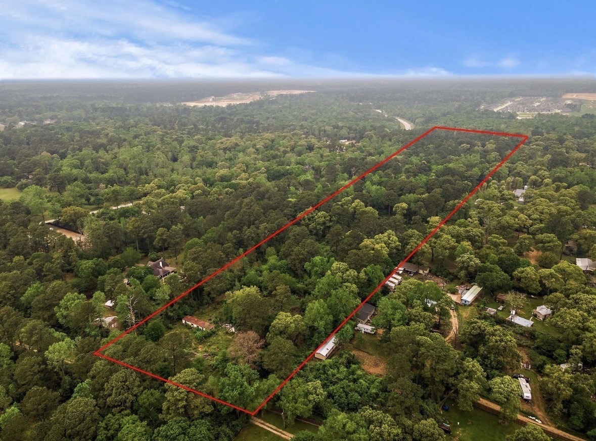 22414 Mueschke Road Tomball, TX 77377 - Photo 2 of 2 an aerial view of residential houses with outdoor space and trees