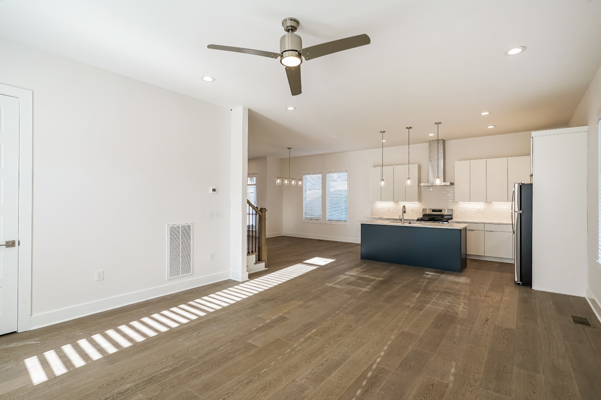 922 Crescent Hill Road, Unit B Nashville, TN 37206 - Photo 3 of 17 a view of a kitchen with refrigerator and wooden floor