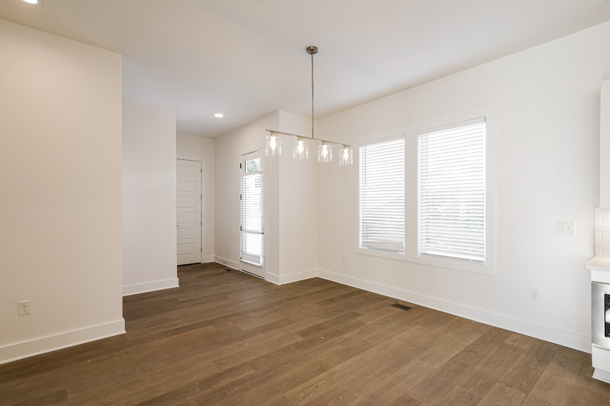 922 Crescent Hill Road, Unit B Nashville, TN 37206 - Photo 4 of 17 an empty room with wooden floor and windows