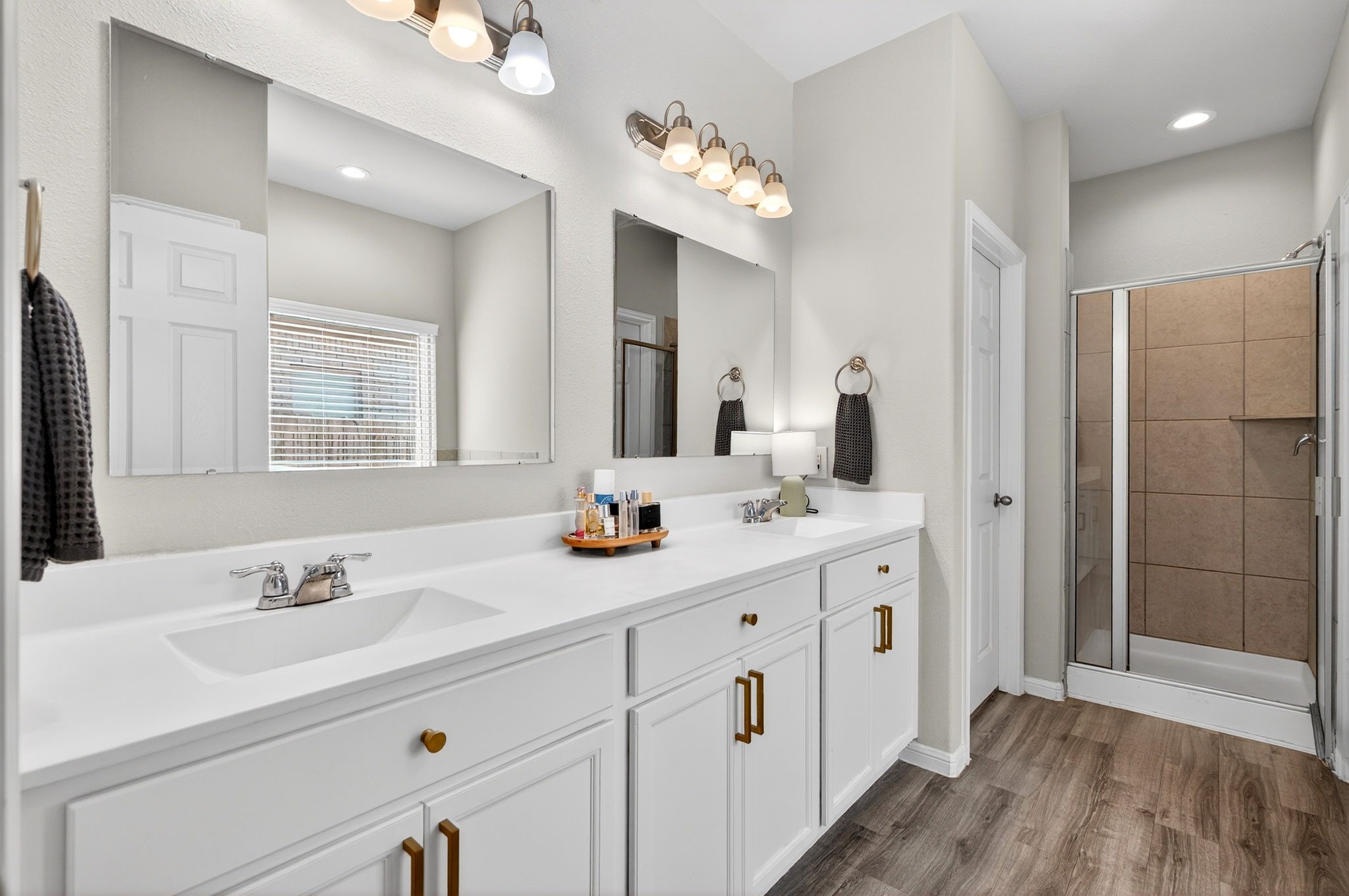 2121 Cedar Way Drive Conroe, TX 77301 - Photo 14 of 27 a bathroom with a double vanity sink mirror and shower