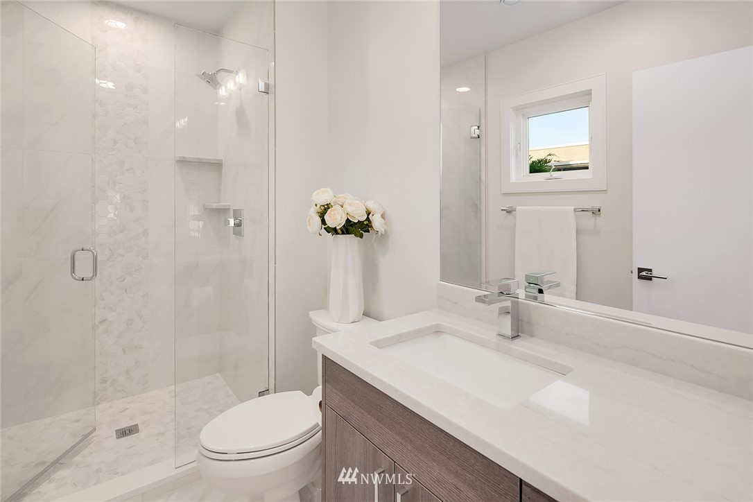 8431 Ridge Road Medina, WA 98039 - Photo 30 of 40 a bathroom with a sink toilet and shower