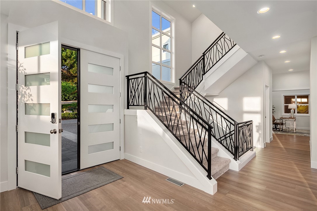 8431 Ridge Road Medina, WA 98039 - Photo 10 of 40 a view of an entryway with wooden floor and windows