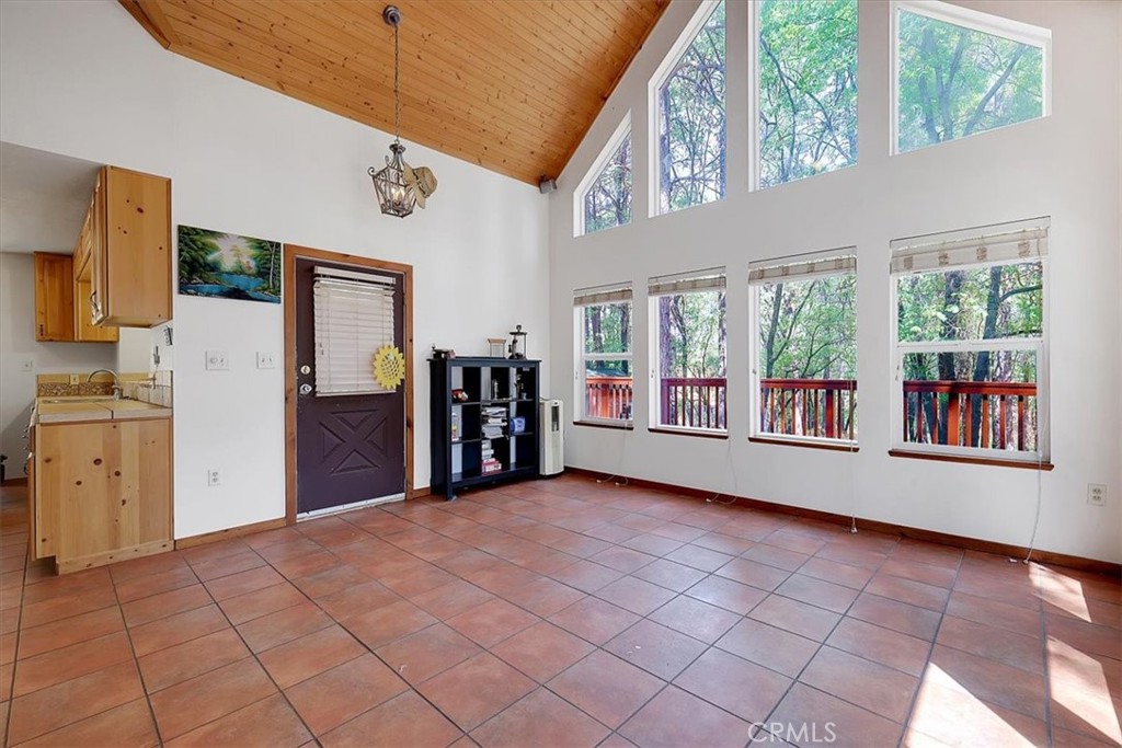 13233 Dixon Hill Road Oregon House, CA 95962 - Photo 13 of 60 a view of an empty room with window and kitchen view