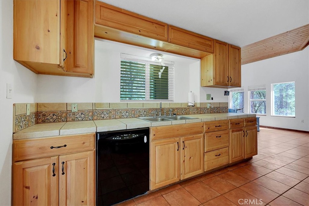 13233 Dixon Hill Road Oregon House, CA 95962 - Photo 18 of 60 a kitchen with stainless steel appliances granite countertop a sink and cabinets with wooden floor