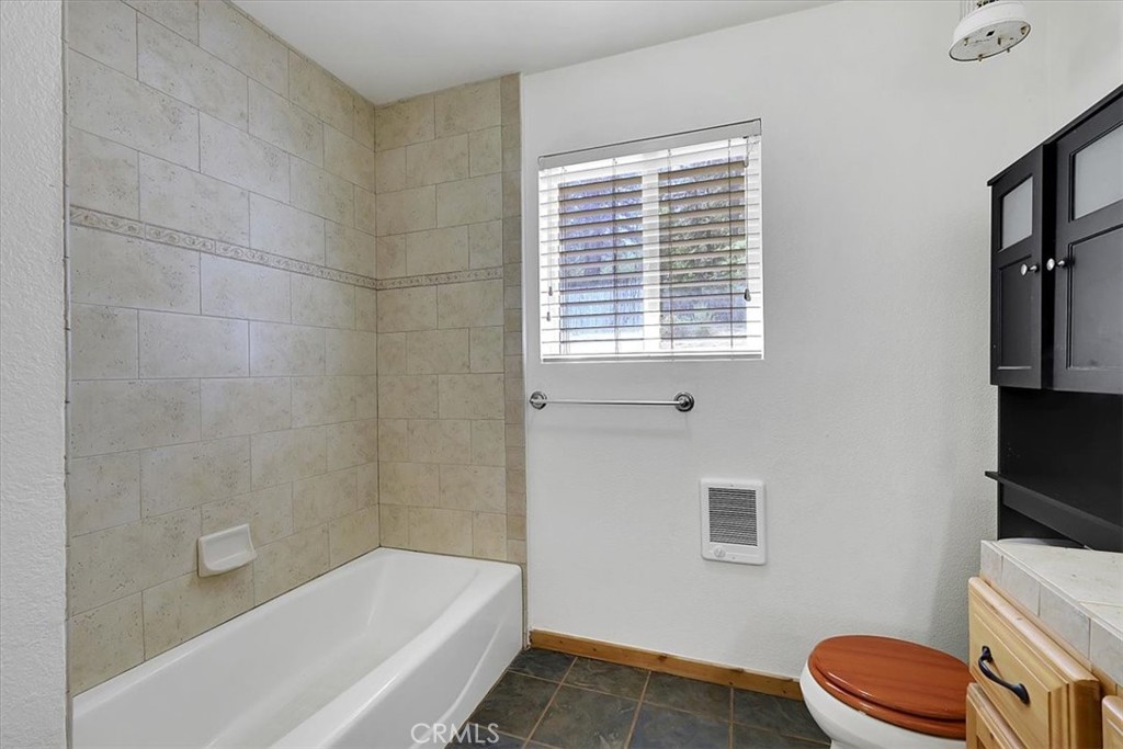 13233 Dixon Hill Road Oregon House, CA 95962 - Photo 27 of 60 a bathroom with a tub a toilet and a shower