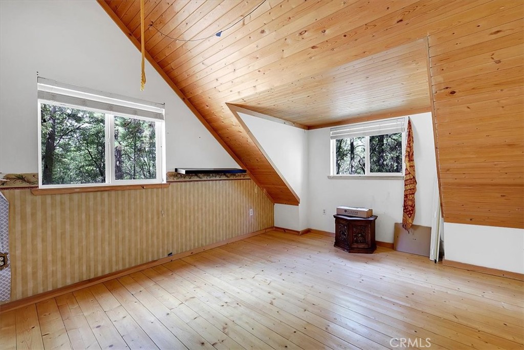 13233 Dixon Hill Road Oregon House, CA 95962 - Photo 29 of 60 a view of an empty room with wooden floor and a window