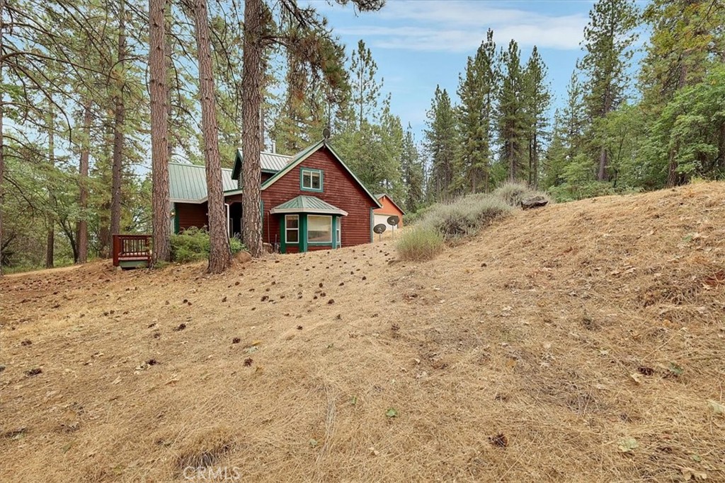 13233 Dixon Hill Road Oregon House, CA 95962 - Photo 3 of 60 a view of a house with a yard covered in snow