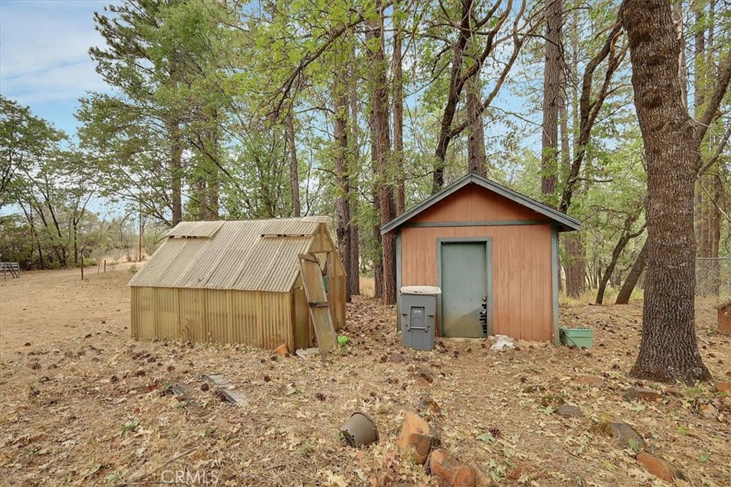 13233 Dixon Hill Road Oregon House, CA 95962 - Photo 42 of 60 a view of a house with a yard and large tree