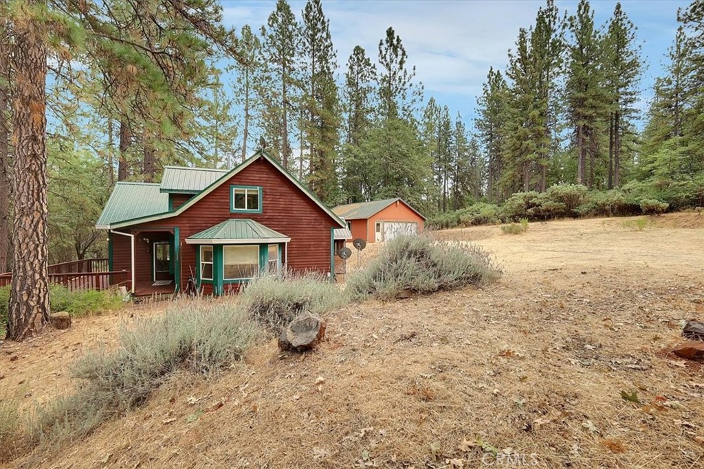 13233 Dixon Hill Road Oregon House, CA 95962 - Photo 47 of 60 a front view of a house with a yard and garage