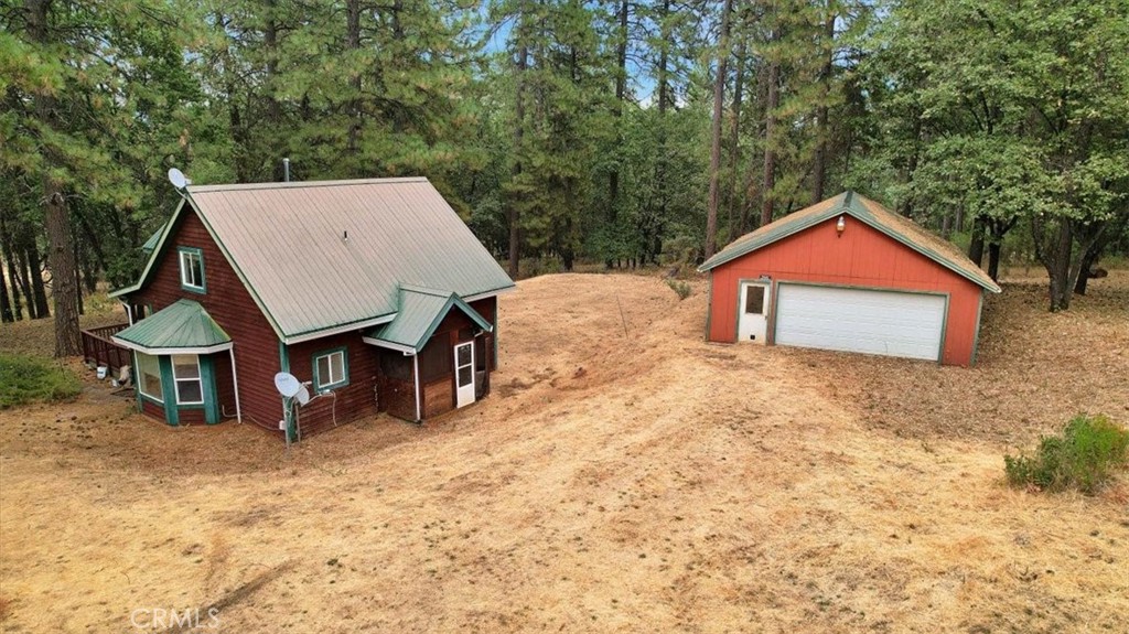 13233 Dixon Hill Road Oregon House, CA 95962 - Photo 50 of 60 a view of a house with a yard and sitting area