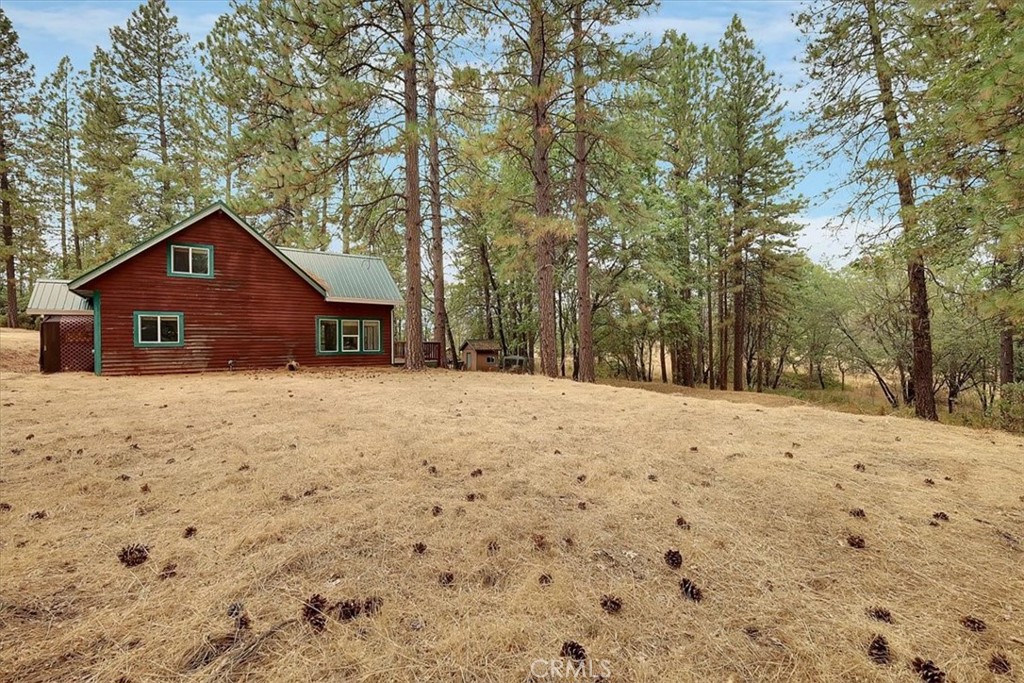 13233 Dixon Hill Road Oregon House, CA 95962 - Photo 5 of 60 a view of a house with a yard covered in snow