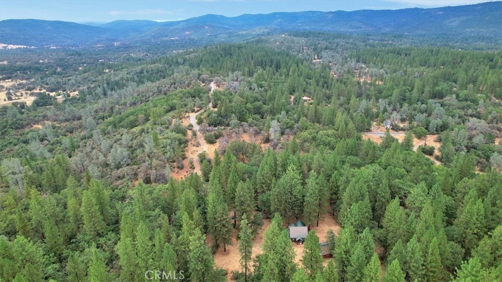 13233 Dixon Hill Road Oregon House, CA 95962 - Photo 53 of 60 a view of a lush green hillside and a building