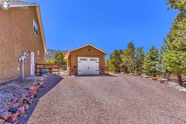 182 Raptor Court Canon City, CO 81212 - Photo 40 of 50 In addition to the attached garage, the property includes a fully insulated one-car detached garage that provides excellent extra space for storage, hobbies, or a workshop. Whether you need extra storage or a dedicated workspace, this detached garage adds great flexibility.