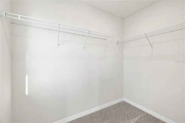 a bathroom with a double vanity sink toilet and shower