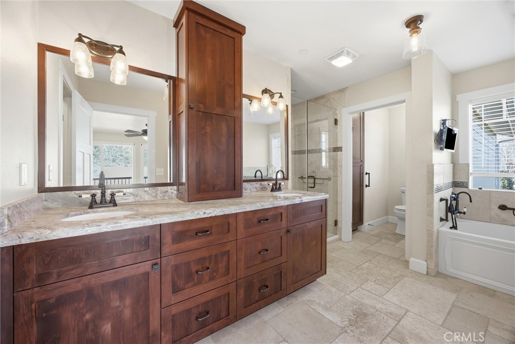 9401 Whispering Pines Road Frazier Park, CA 93225 - Photo 20 of 49 a spacious bathroom with a granite countertop sink mirror and bathtub
