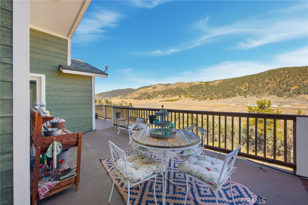 9401 Whispering Pines Road Frazier Park, CA 93225 - Photo 32 of 49 a view of a chairs and table in patio