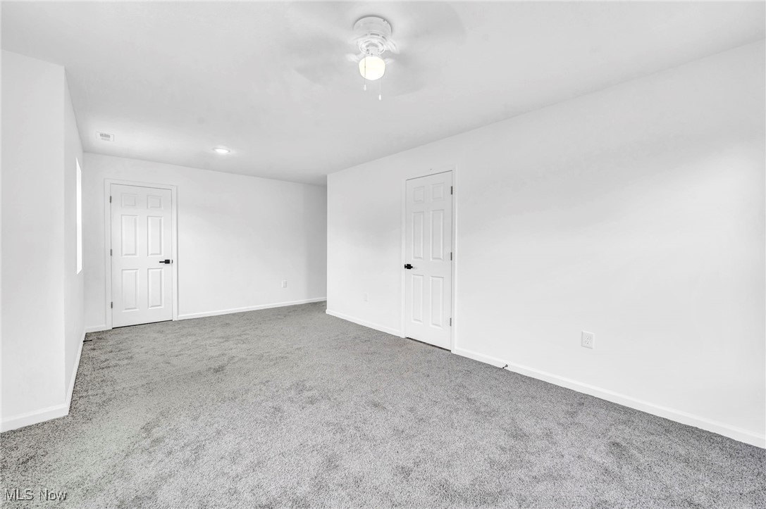 3709 Sudbury Road Cleveland, OH 44120 - Photo 16 of 29 Carpeted spare room with ceiling fan