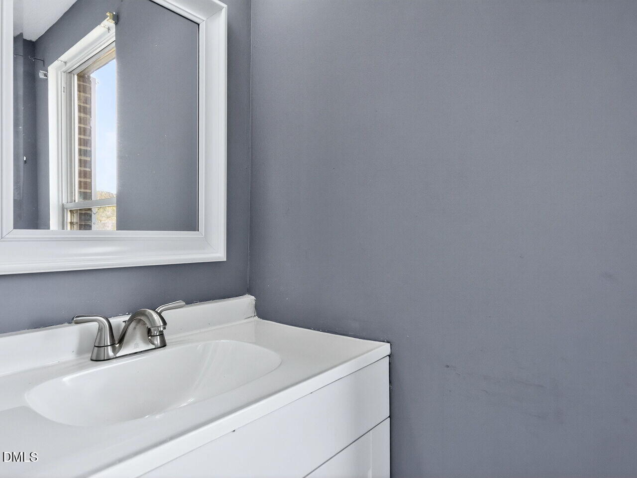 4333 Halliwell Drive Raleigh, NC 27606 - Photo 11 of 31 a bathroom with a sink and a window