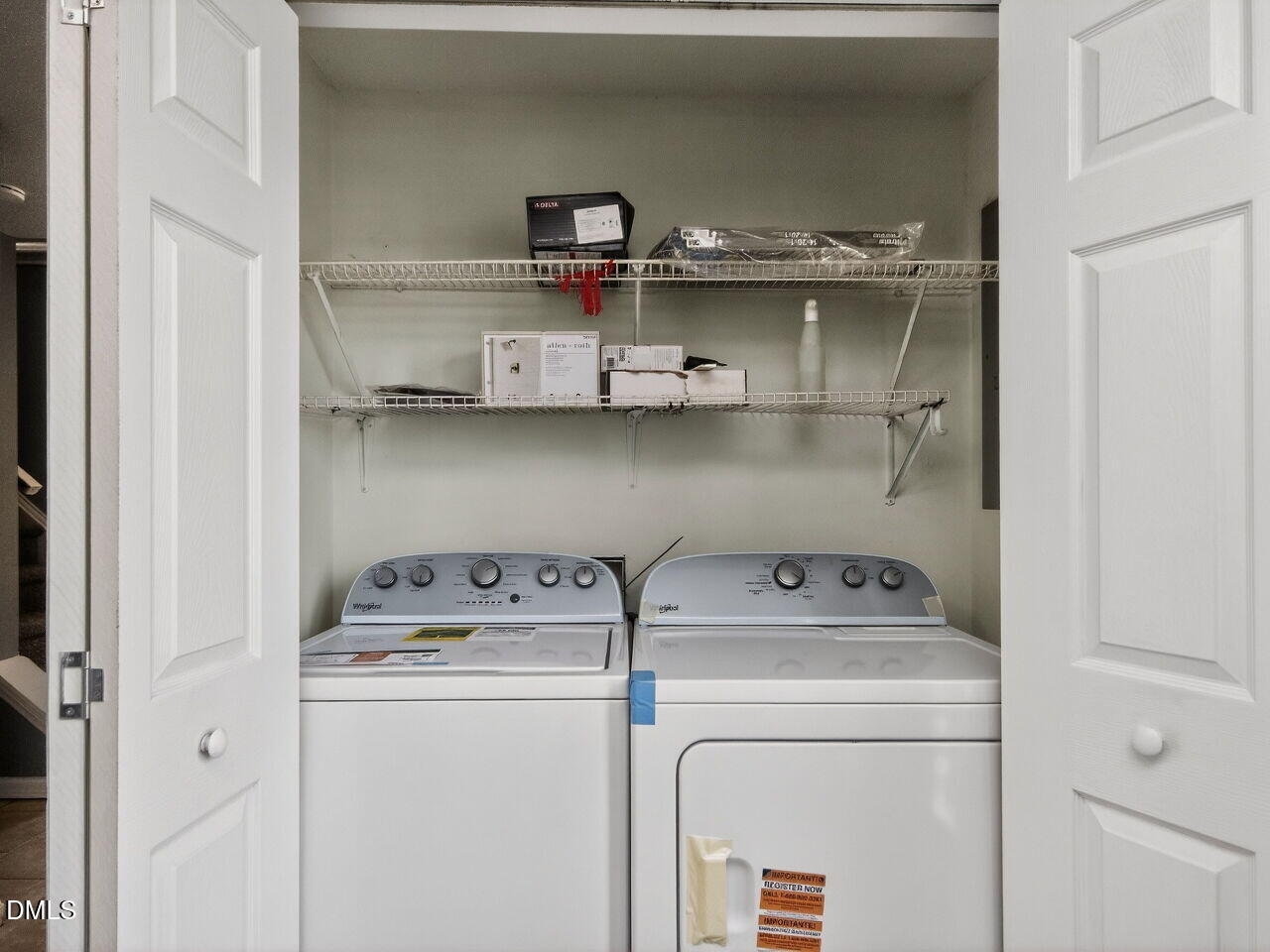 4333 Halliwell Drive Raleigh, NC 27606 - Photo 12 of 31 a utility room with dryer washer and empty racks