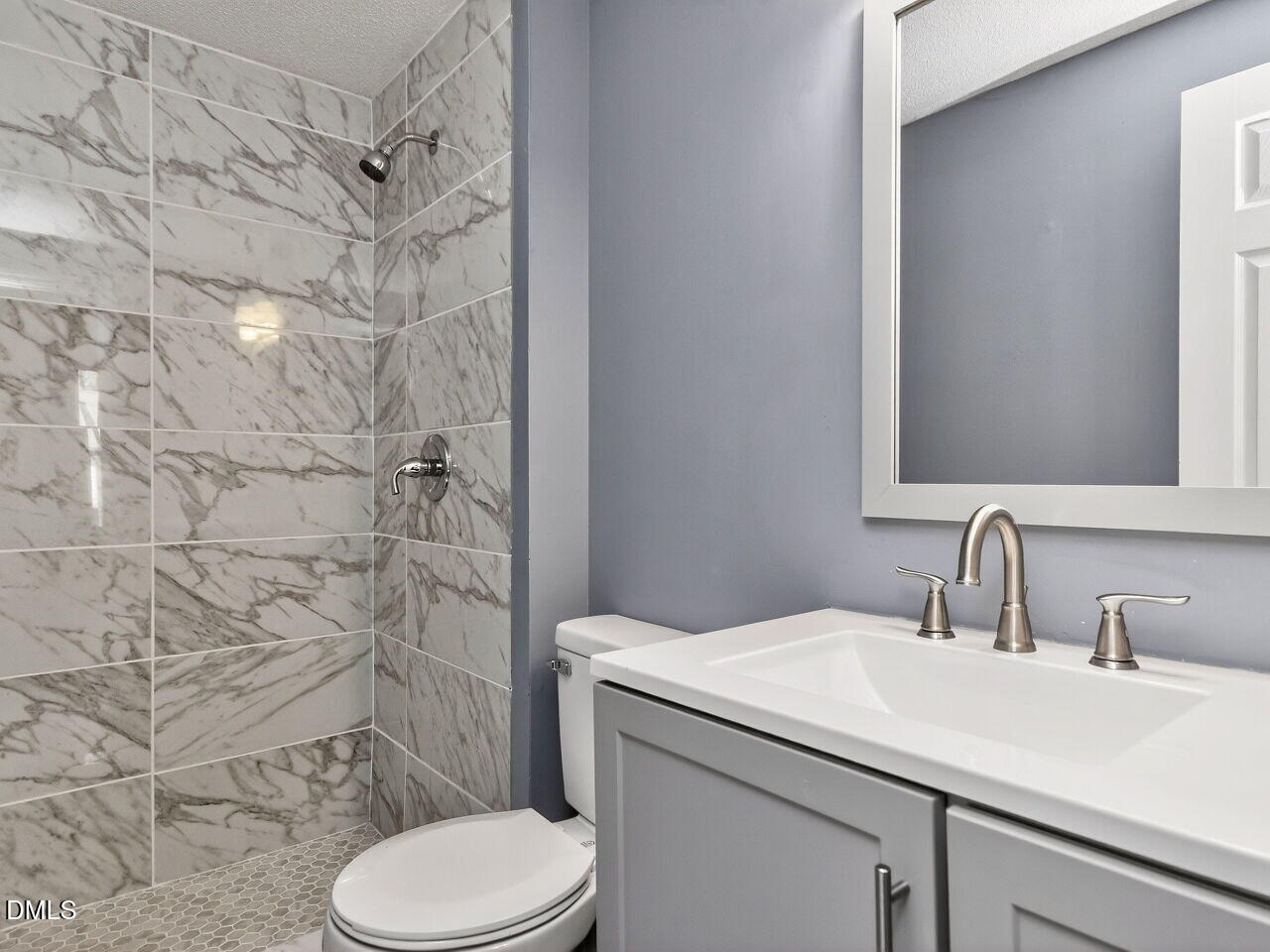 4333 Halliwell Drive Raleigh, NC 27606 - Photo 16 of 31 a bathroom with a sink toilet and shower