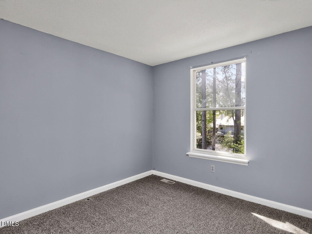 4333 Halliwell Drive Raleigh, NC 27606 - Photo 18 of 31 an empty room with a window