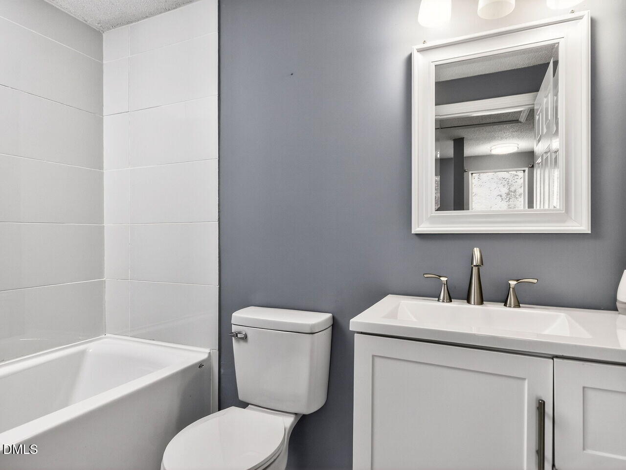 4333 Halliwell Drive Raleigh, NC 27606 - Photo 20 of 31 a bathroom with a sink toilet and bathtub