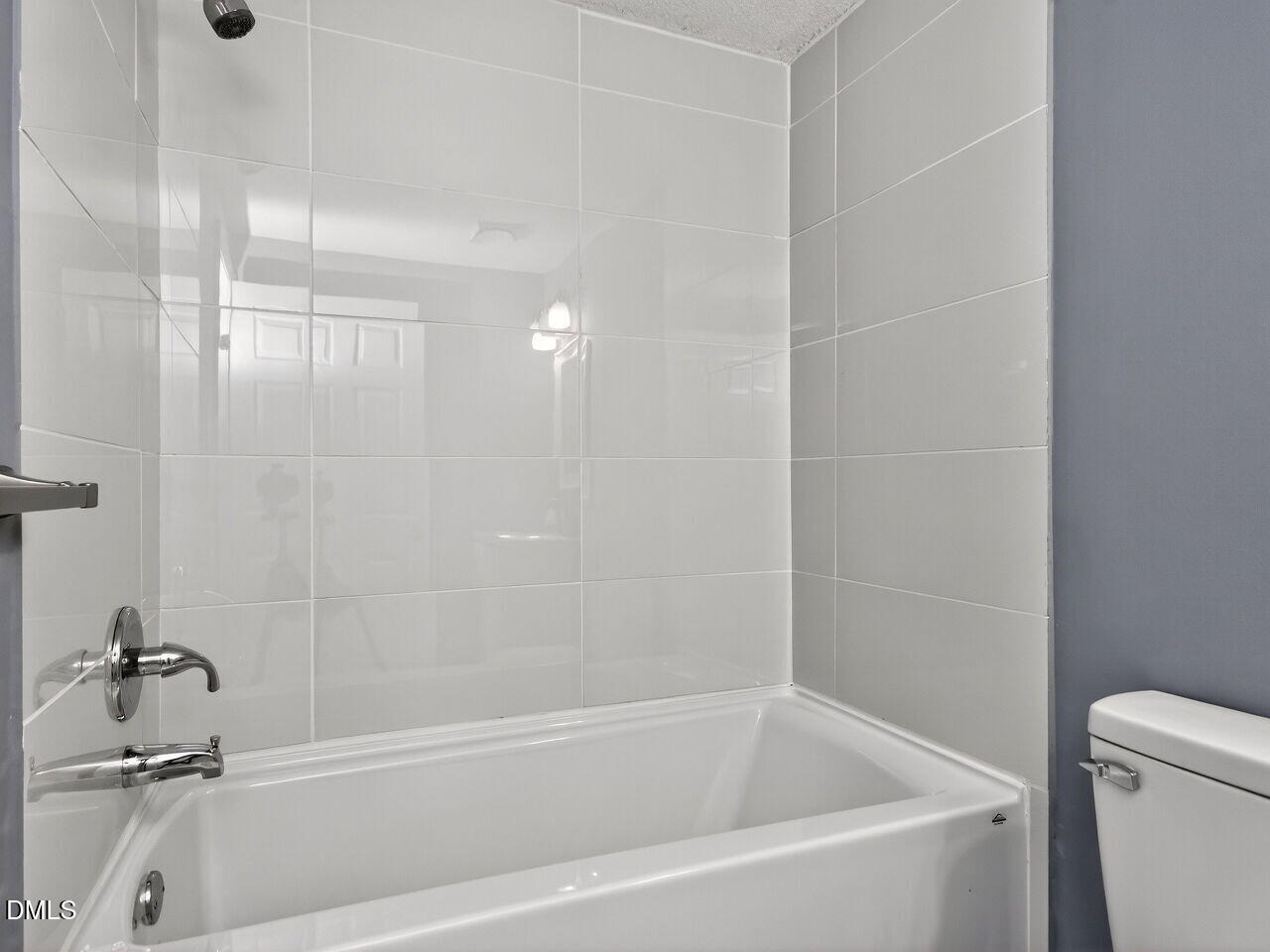 4333 Halliwell Drive Raleigh, NC 27606 - Photo 21 of 31 a bathroom with a bathtub