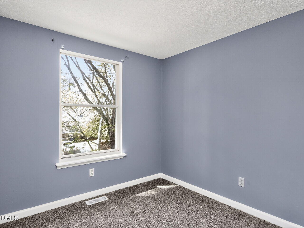 4333 Halliwell Drive Raleigh, NC 27606 - Photo 22 of 31 an empty room with windows
