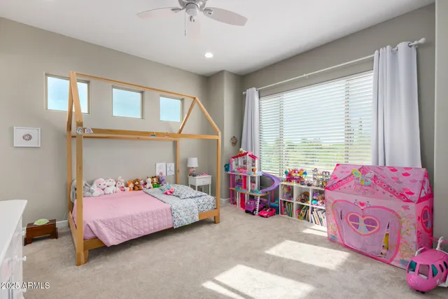 a bedroom with a bed and a couch